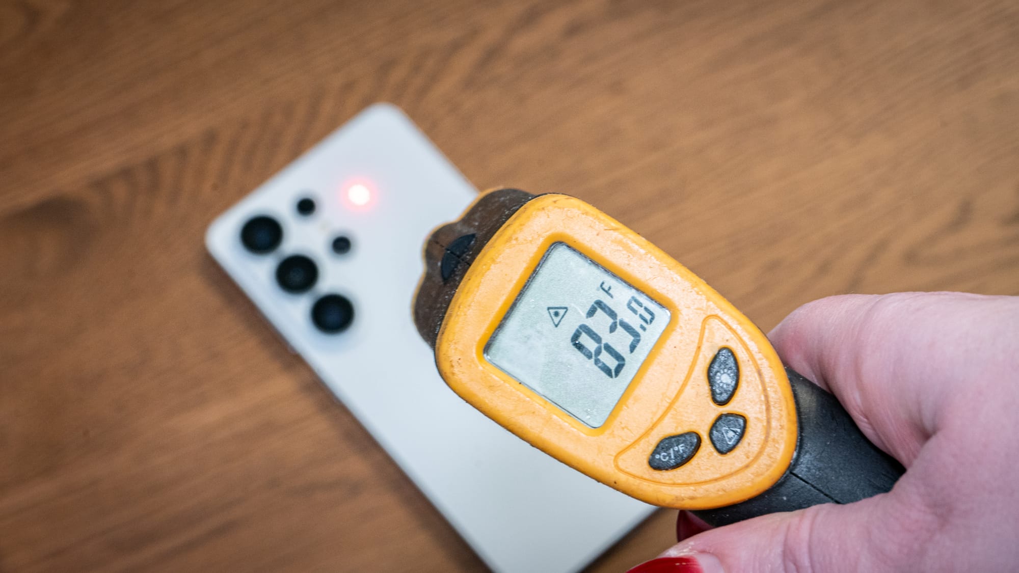 a photo of a person shooting a thermal gun at the Galaxy S26 Ultra 