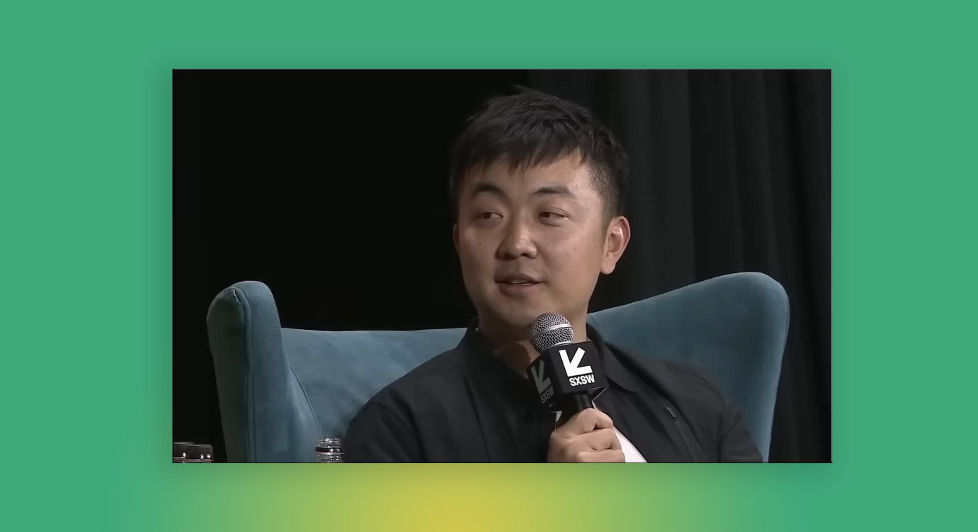 a photo of Carl Pei on stage at SXSW mid-sentence